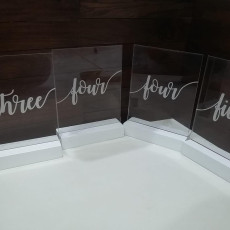 Acrylic table number, white wood based. Available table one - seven.